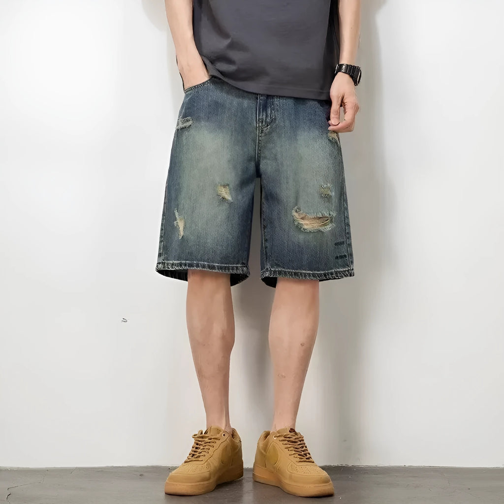 Blue retro loose-fit men's denim shorts with distressed holes and a straight-leg cut