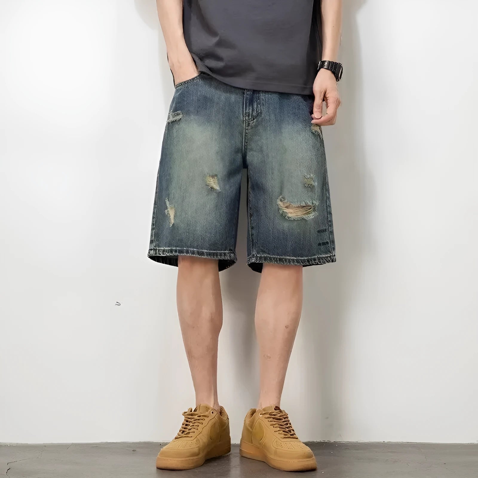 Blue retro loose-fit men's denim shorts with distressed holes and a straight-leg cut