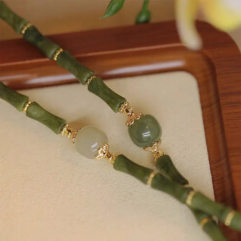 Women's simple geometric Hetian jade bangle bracelet in dark green and light colour options.
