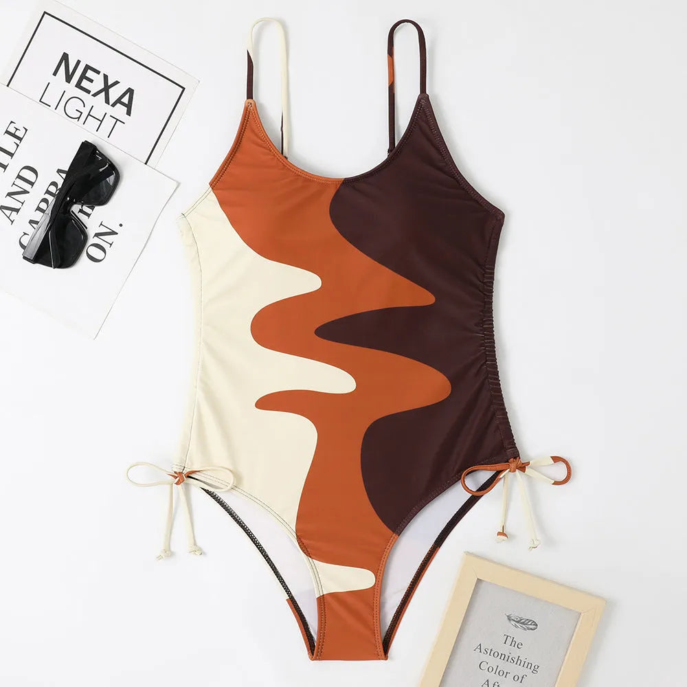 Women's sleeveless backless one-piece swimsuit in blue striped print