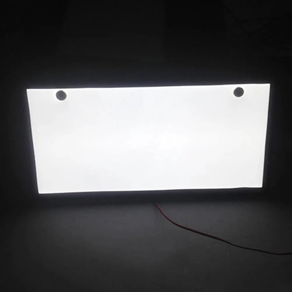 Two white LED truck licence plate lights with flat thin plastic housings and visible LED lamp bars.