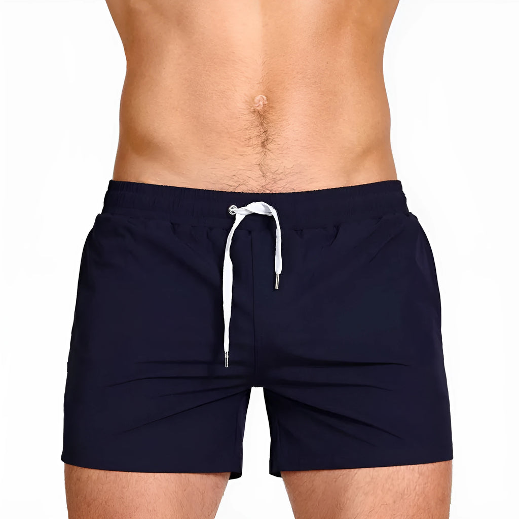 Polyester mesh-lined sports shorts in solid colours for swimming and fitness.