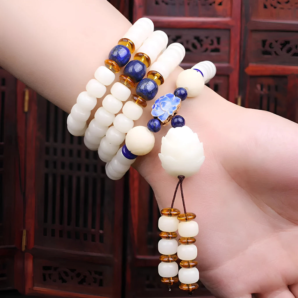 White jade bodhi seed bracelet with 6x8mm beads shown in multiple styles including cloisonne and lotus.