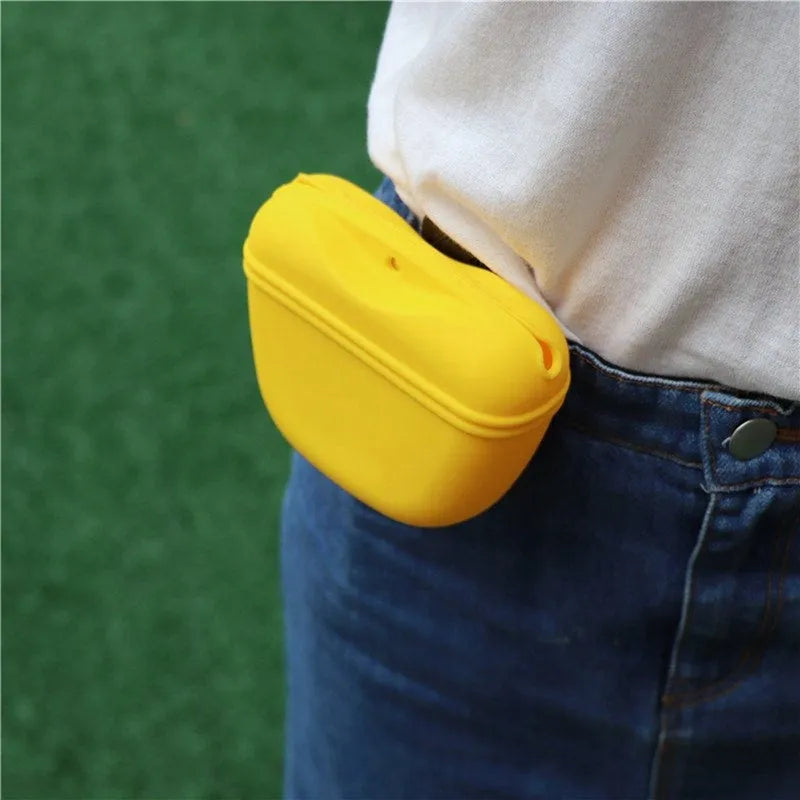 Silicone dog training treat waist bag with clip, shown in various colours.