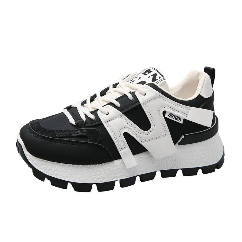 Women's low-top sneaker in black with artificial PU upper, rubber sole, and front lace-up closure.