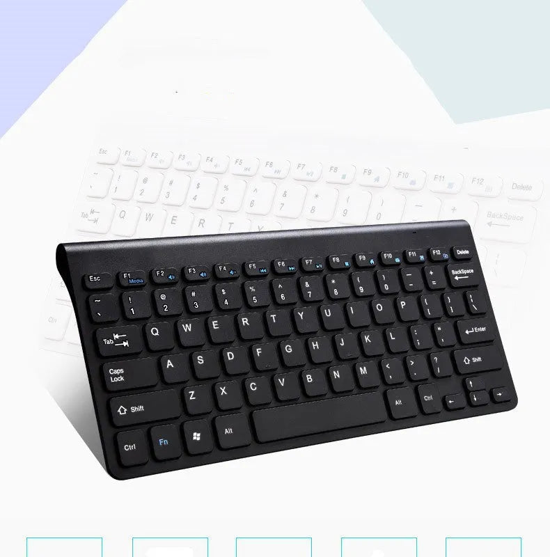 Black wireless keyboard and mouse set with USB receiver on wooden desk