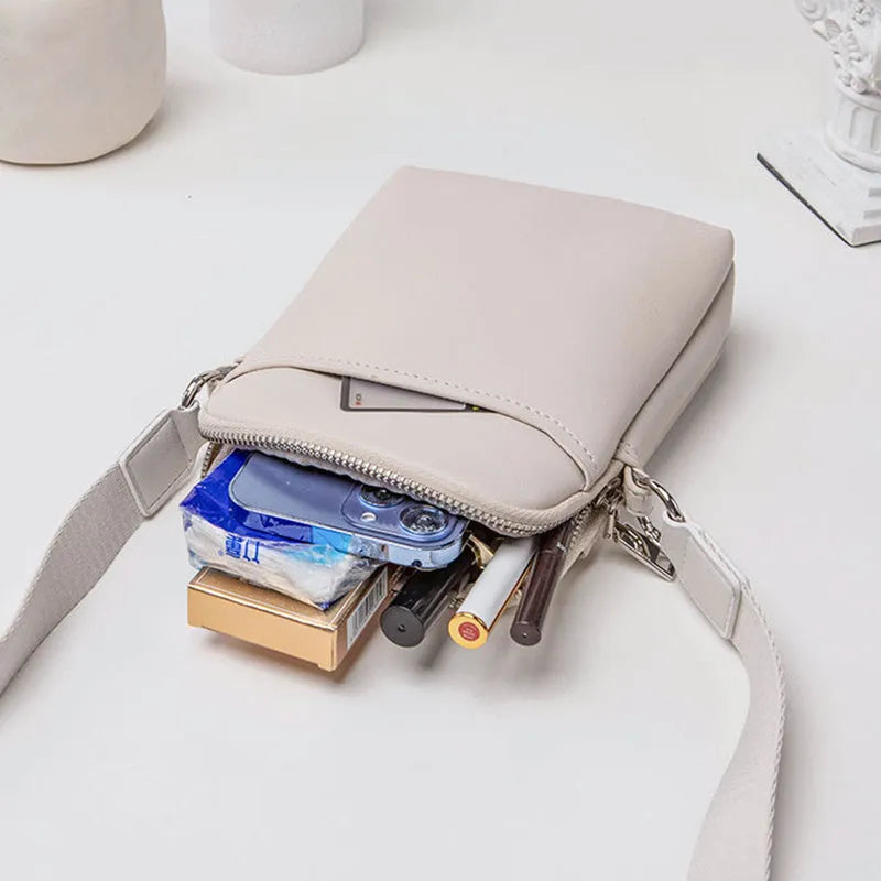 Solid colour PU leather crossbody phone bag in beige, shown with adjustable strap.
