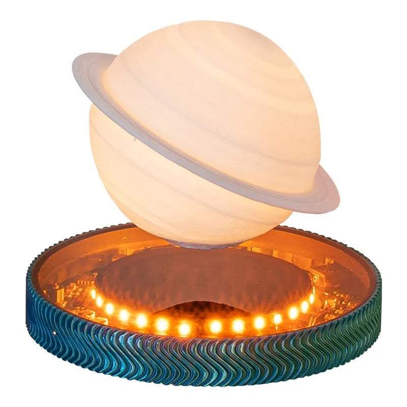 Small magnetic suspension night lamp in a choice of 3D-printed Moon, Saturn, or Bulb shapes on a dark background.