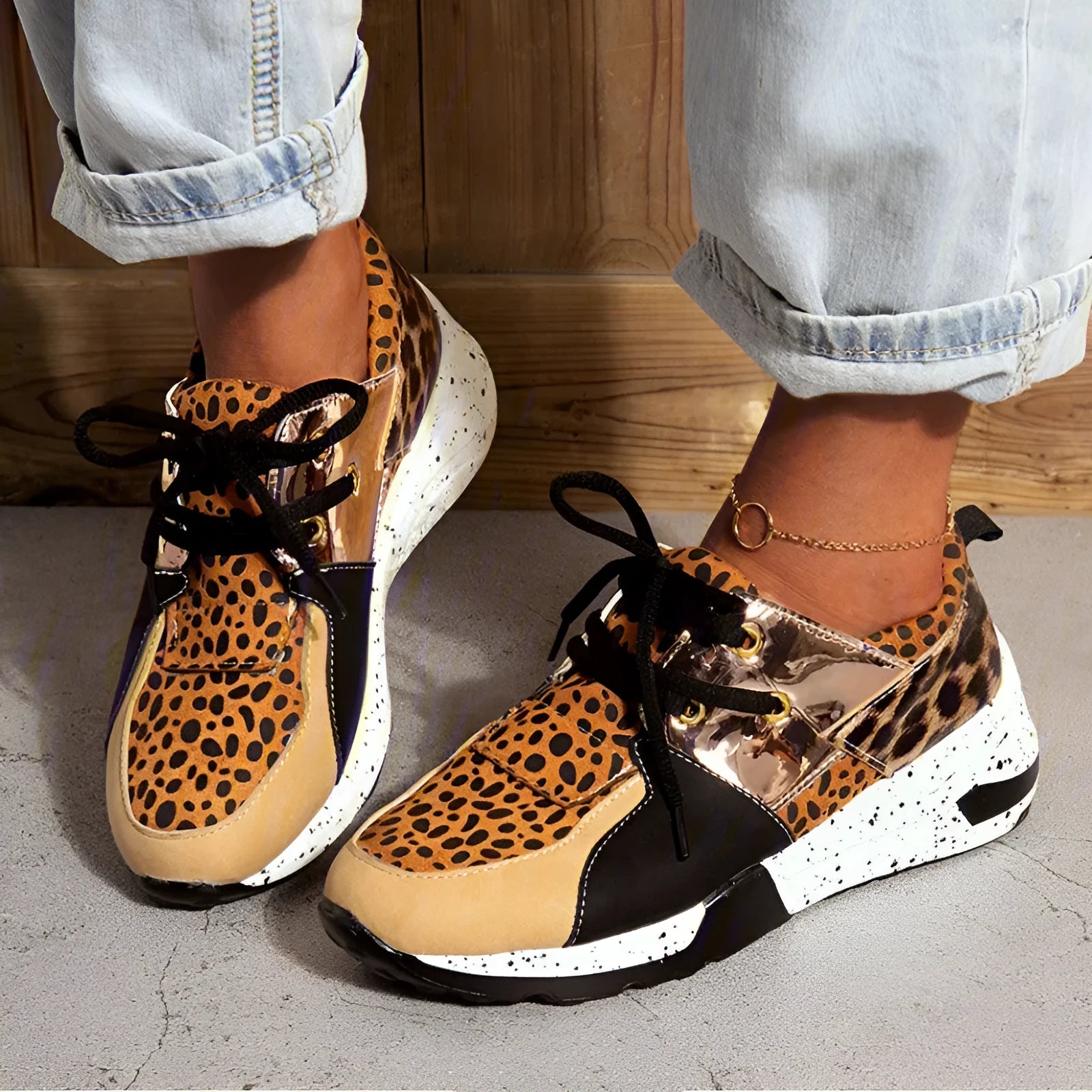 Women's casual suede wedge sneakers in leopard print with a low-cut design and plastic sole.