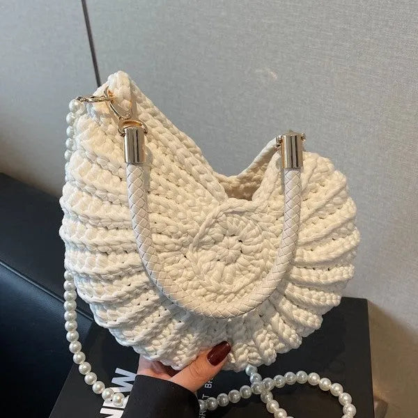 Handmade woven cloth bag in retro style with open pocket and double shoulder straps.