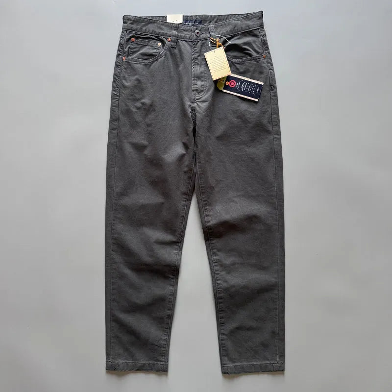 Men's straight-leg cotton casual trousers in grey, army green, and khaki colours on a mid waist fit model