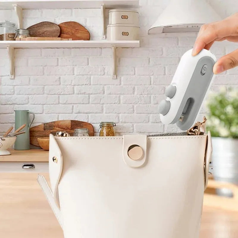 Blue and white handheld USB rechargeable heat sealer for sealing chip bags and food storage