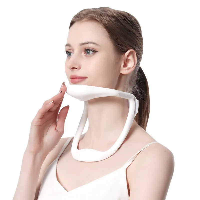 White PP plastic neck brace for cervical spine support shown on a grey background.