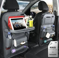Black PU leather car seat back storage organiser with multiple pockets, attached behind a car headrest.