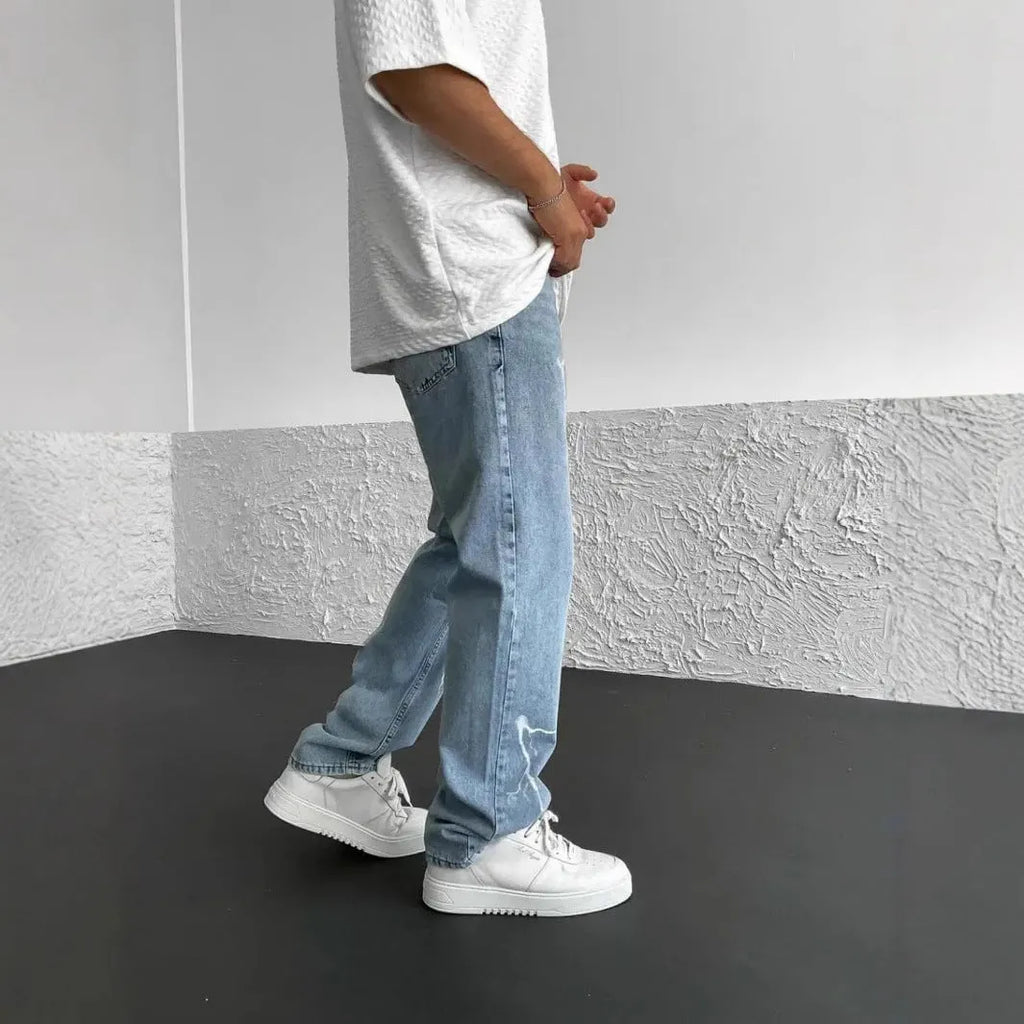 Men's blue straight-leg denim trousers with mid waist and zipper fly closure