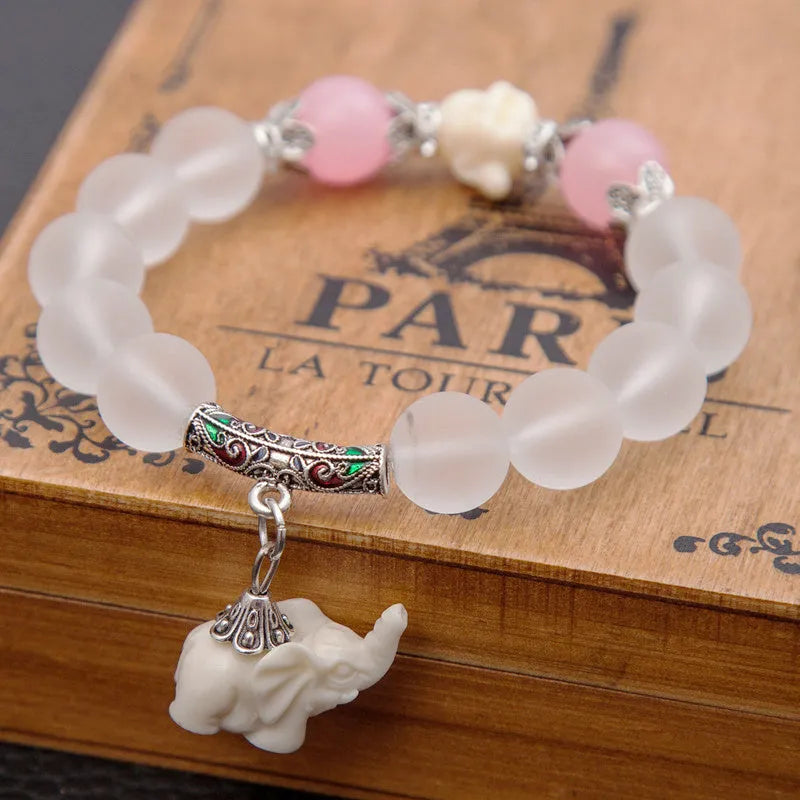 Crystal elephant charm bracelet with clear beads and gold finish metal charm