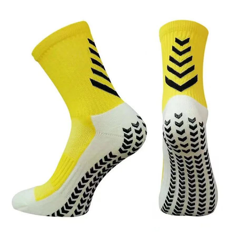 Men's black and green mid-calf athletic socks with a geometric pattern and non-slip silicone grip.