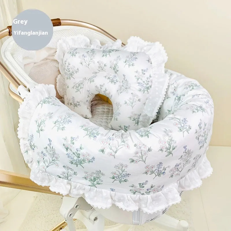 A green grey striped towel, cushion, and pillow set for a pet stroller, shown removed and ready for washing.
