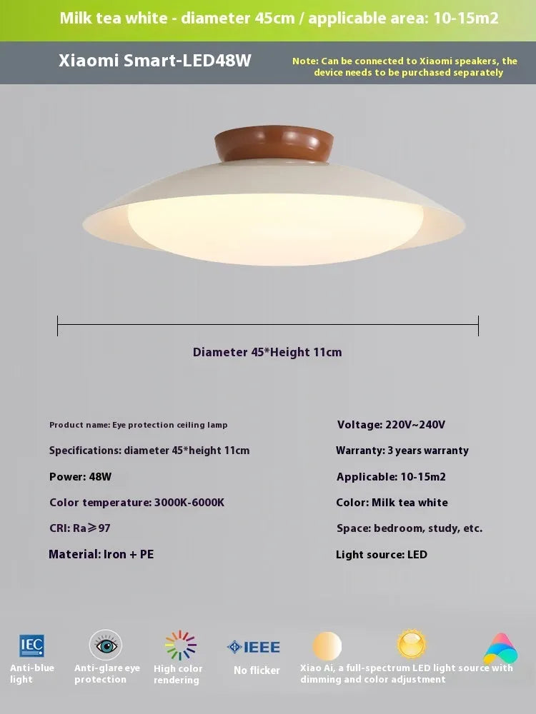 Modern cream style flying saucer shaped ceiling lamp in an iron shade.