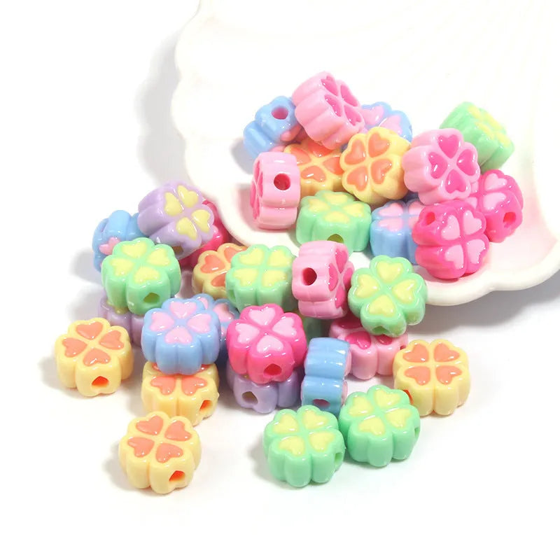 15mm acrylic clover craft beads with frosted finish in multiple colours including pink, blue, yellow, and green