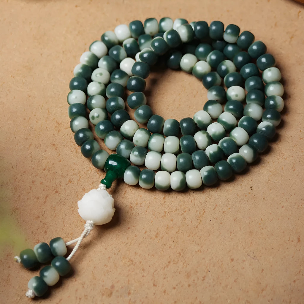 Lotus White Jade Bodhi Beads Bracelet showing floating flowers pattern on Bodhi root beads