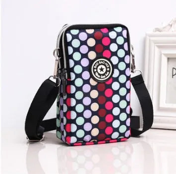 Vertical mobile phone bag in black with Oxford Spinning texture and zipper closure