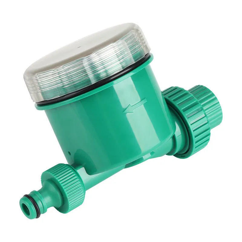 Green plastic automatic watering timer with digital display for garden hose connection.