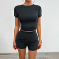 Women's solid colour viscose fibre slim-fit T-shirt and elastic shorts two-piece set.