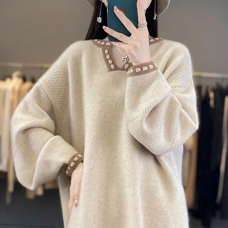 Women's camel-coloured V-neck long sleeve viscose pullover sweater on a hanger.