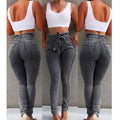 Cowboy fabric fringed jeans in dark blue, grey, or light blue on a model.