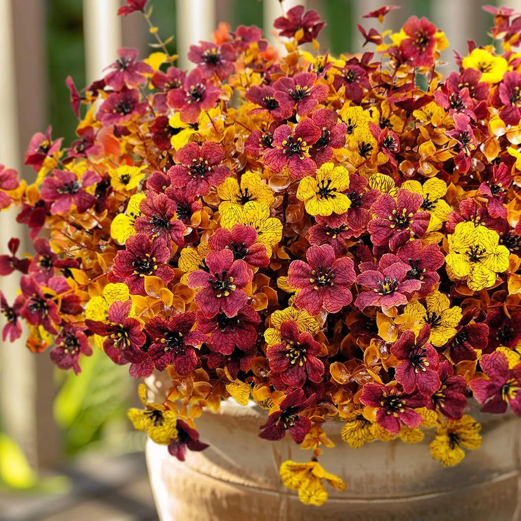 Plastic artificial flower bouquet with silk details in autumn orange, orange yellow, red or yellow for home and wedding decoration