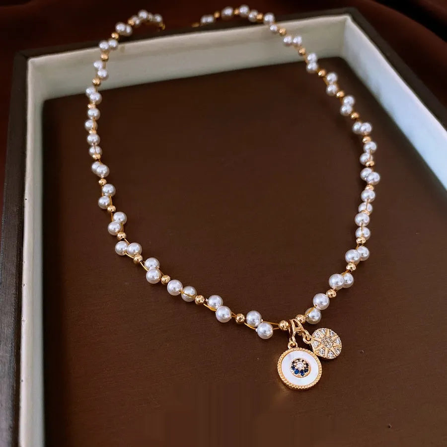 Gold electroplated zircon pearl round pendant necklace on clavicle chain with Chinese style design
