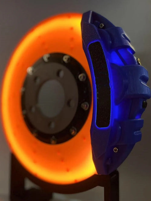 Brake disc themed LED desktop night light in blue caliper colour with touch control