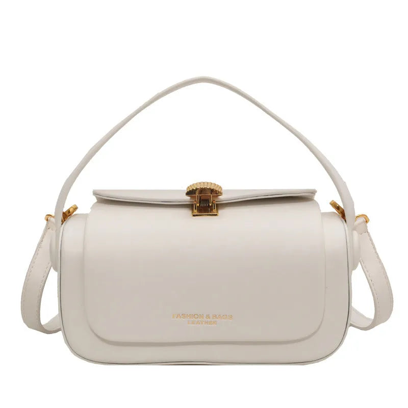 A personalised women's PU messenger bag in beige with a monogram letter and stitching detail.