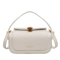 A personalised women's PU messenger bag in beige with a monogram letter and stitching detail.