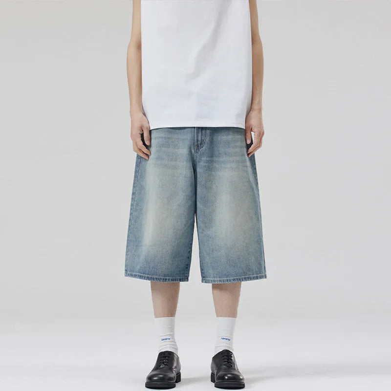 A pair of light blue denim shorts with a loose straight leg and cropped length on a neutral background.