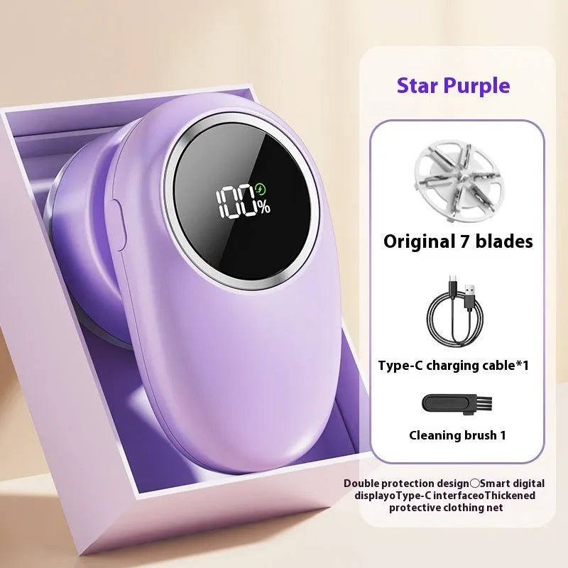 Beige and purple digital fur ball trimmer lint remover with selectable cutter heads on a table