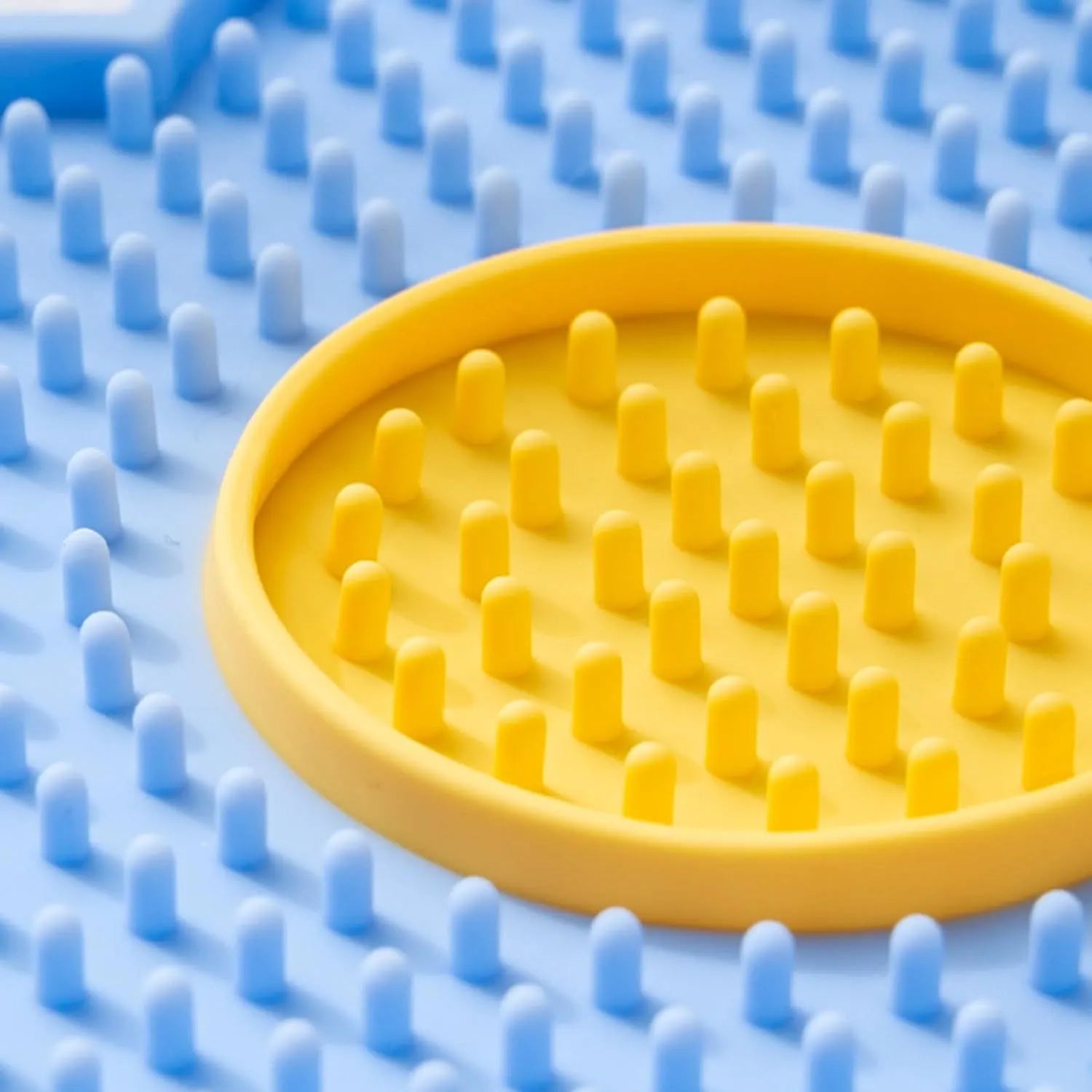 Grey flower-shaped silicone pet lick mat with suction cups for slow feeding