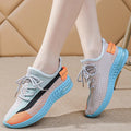Women's lightweight casual running shoe in purple with front lace-up, round toe, and flat heel.