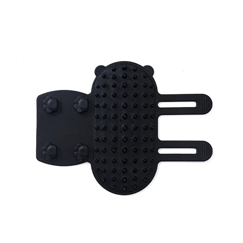 Silicone cat grooming comb with adjustable strap mounted on a furniture leg