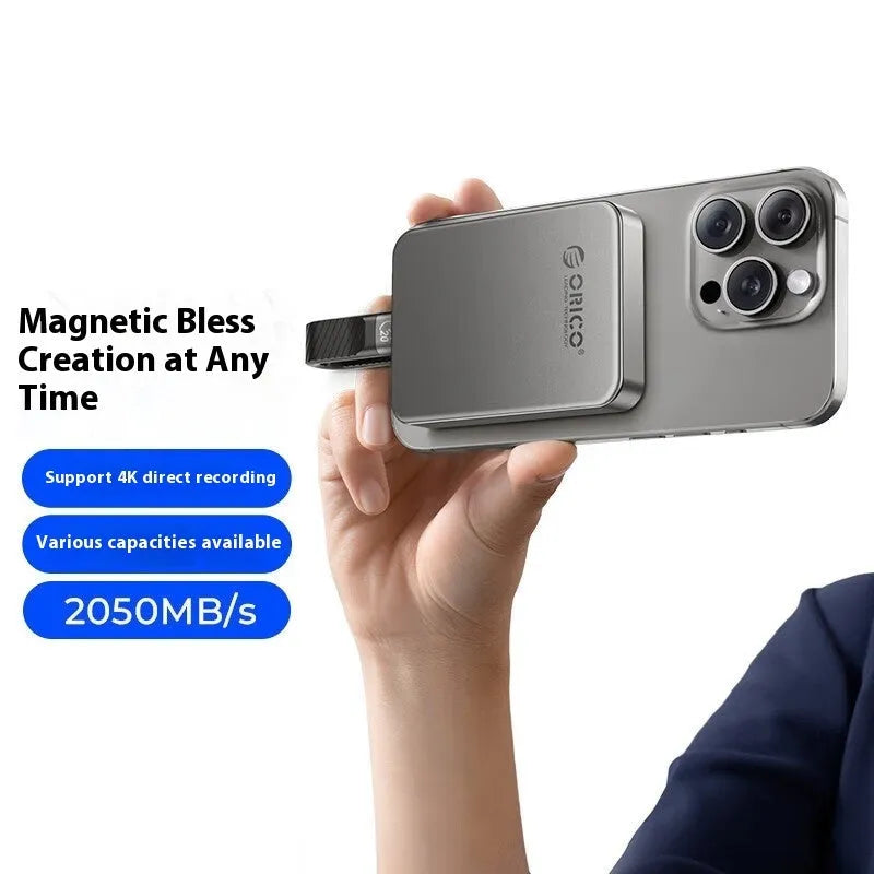 Grey magnetic mobile external SSD for phones and computers with a C to C cable and magnetic ring.