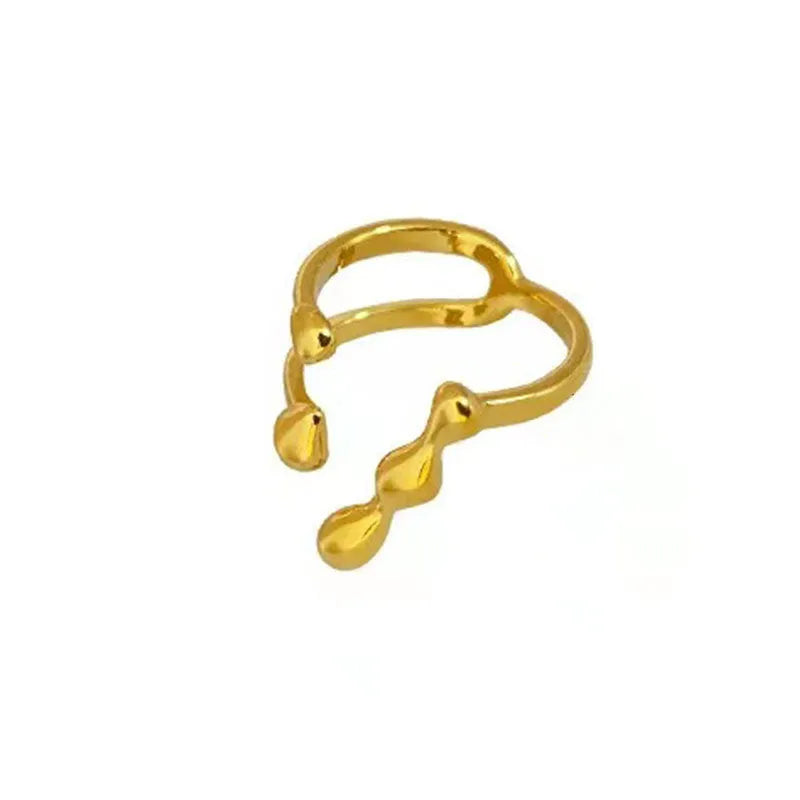 Brass spherical ring for women in gold or silver colour on a circular band.