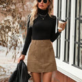 Women's high waist short skirt with stitching detail and front zipper in black, camel, brick red, or dark green.