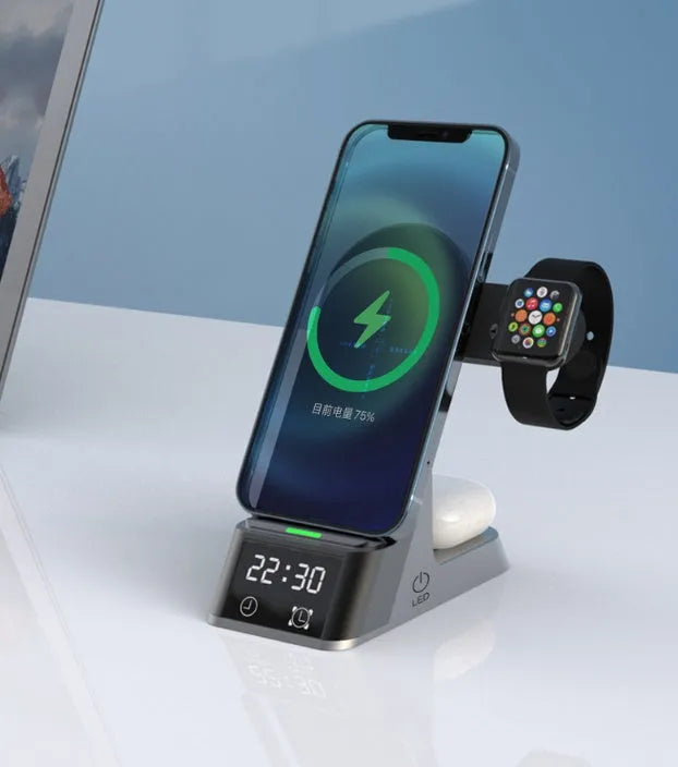 Black six-in-one wireless charging alarm clock with colour display on a nightstand.