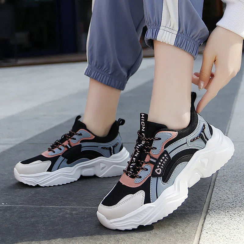White women's casual sport shoes with a mesh upper, thick PU sole, buckle detail, and round toe.
