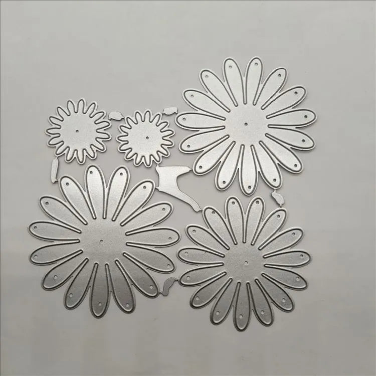 Silver high carbon steel flower combination cutting die mould measuring 12.5 by 13 cm
