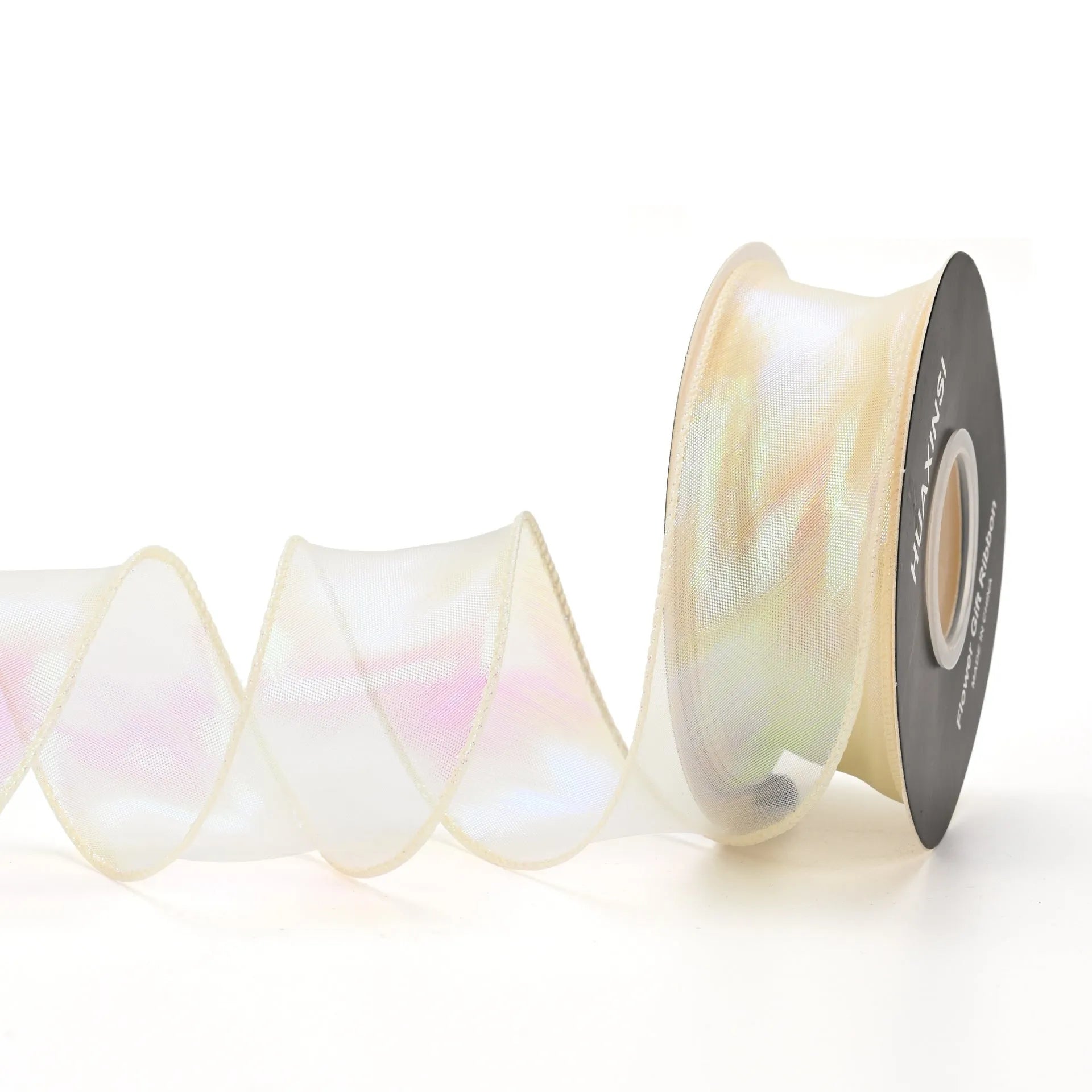 Roll of 4cm wide colourful mesh ribbon with fishtail yarn floral wave design.