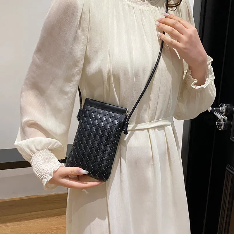 Vintage weave crossbody bag in vertical square shape showing European retro styling and dark cell internal compartment
