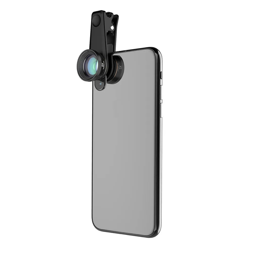 Black 6-in-1 universal smartphone camera lens kit with fisheye, wide-angle, macro, telephoto, CPL, and star filter lenses on a table.
