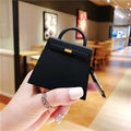 Silicone anti-drop earphone case for Apple AirPods 1 and 2 in black or orange, clamshell bag shape.